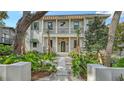 Charming home exterior with a manicured front yard, stone pathway, balcony, and an inviting entryway at 1658 Bonita Ln, Sarasota, FL 34239