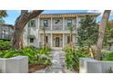 Stunning two-story home featuring a landscaped front yard, balcony, and elegant entrance at 1658 Bonita Ln, Sarasota, FL 34239