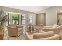 Bright living space with comfortable chairs and large windows that let in plenty of natural light at 2103 Harbourside Dr # 1102, Longboat Key, FL 34228