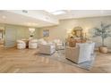 Elegant living room showcasing stylish decor and comfortable seating around a glass coffee table at 2103 Harbourside Dr # 1102, Longboat Key, FL 34228