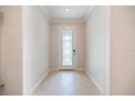Bright foyer featuring decorative front door and light tile flooring at 2316 Springhaven Ln, Lakewood Ranch, FL 34211