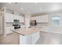 Open kitchen with granite countertops, stainless steel appliances and white cabinetry at 2316 Springhaven Ln, Lakewood Ranch, FL 34211