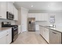 Beautiful kitchen features modern appliances and a large center island at 2316 Springhaven Ln, Lakewood Ranch, FL 34211