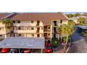 This building's exterior offers a covered parking area and a private balcony at 2395 Harbor Blvd # 314, Port Charlotte, FL 33952
