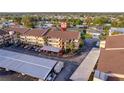 Exterior aerial view featuring covered parking and ample resident parking at 2395 Harbor Blvd # 314, Port Charlotte, FL 33952