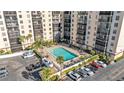 An aerial view of a condo building shows the swimming pool and parking at 2901 26Th W St # 204, Bradenton, FL 34205