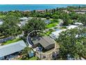 Aerial view of a single Gathering home with a fenced-in backyard near the water at 3307 Miami Pl, Bradenton, FL 34207
