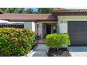 Close up of the front gate and garden, showing the landscaped entrance to the home at 3615 Puerta Ct # 8516, Sarasota, FL 34232