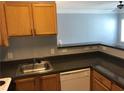 Well-equipped kitchen features stainless steel sink, wood cabinets, and laminate counters at 4802 51St W St # 1313, Bradenton, FL 34210
