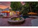 Beautiful backyard featuring a pool, hot tub, lounge chairs, and outdoor dining area, perfect for relaxing at 522 31St W St, Bradenton, FL 34205