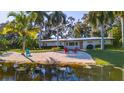 Charming Florida home with a private sandy beach area, perfect for relaxing by the water at 5311 36Th E Ave, Palmetto, FL 34221