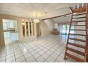 Bright living room with ceramic tile floors, showcasing the open layout at 6305 Bikini Rd, Sarasota, FL 34241