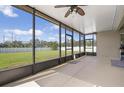 Spacious screened patio offering beautiful views of the backyard and clear skies at 7750 Ridgelake Cir, Bradenton, FL 34203
