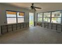 A large living room awaits renovation and finishing with bright, natural light at 13434 1St St E, Madeira Beach, FL 33708
