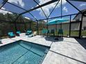 Stunning pool area with a spacious deck, perfect for lounging and enjoying outdoor activities at 16231 Tradewind Ter, Bradenton, FL 34211