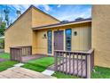 Charming home featuring unique landscaping, a front porch, and a cozy entrance at 2315 Riverwood Pines Dr, Sarasota, FL 34231