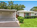 Charming exterior view featuring a carport and well-manicured lawn, blending comfort and curb appeal at 4203 Schwalbe Dr # 115, Sarasota, FL 34235