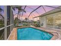 Inviting screened-in pool area features a sparkling pool, comfortable seating, and a relaxing outdoor space for entertaining at 4735 Starboard Dr, Bradenton, FL 34208