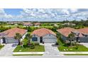Beautiful single-story home with tile roof, landscaping, and paver driveway in quiet neighborhood at 491 Daylily Blvd, Nokomis, FL 34275
