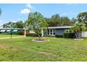 A charming single-story home with a well-maintained lawn and attractive landscaping at 5685 36Th N Ave, St Petersburg, FL 33710