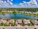 Waterfront home with stunning lake views and a lush green landscape at 6318 Rivo Lakes Blvd, Sarasota, FL 34241