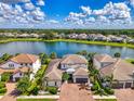 Beautiful lakefront home with a clay tile roof and stunning water views at 6318 Rivo Lakes Blvd, Sarasota, FL 34241
