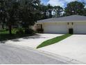 The front yard includes an ample driveway leading to the two car garage at 7157 Fairway Bend Cir, Sarasota, FL 34243