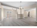 Spacious living room featuring new flooring, neutral paint, and lots of natural light at 719 22Nd W St, Bradenton, FL 34205