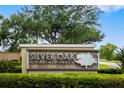 Silver Oak on Palmer Ranch community entrance sign with lush greenery and a manicured landscape at 8999 Wildlife Loop, Sarasota, FL 34238