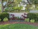 Landscaped community sign reading 'Park View on Costa Circle', set against lush trees and greenery at 900 La Costa Cir # 4, Sarasota, FL 34237