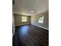 A bright bedroom features wood floors and large windows that let in ample natural light at 1132 26Th S Ave, St Petersburg, FL 33705
