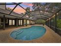 Enjoy the outdoors in this screened in pool area, perfect for entertaining and relaxation at 1509 Shadow Ridge Cir, Sarasota, FL 34240