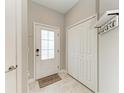 Inviting entryway with a stylish front door, coat closet, welcome mat, and coat rack at 15225 Lyla Ter, Bradenton, FL 34211