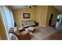 Cozy living room featuring plush seating and lots of natural light at 17215 Berwin Ave, Port Charlotte, FL 33948