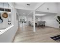 Bright dining room features wood floors and lots of natural light at 2155 Harbourside Dr # 804, Longboat Key, FL 34228
