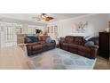 Spacious living room featuring hardwood floors, ceiling fan, and modern decor at 2415 Bayshore Gardens Pkwy # 2, Bradenton, FL 34207