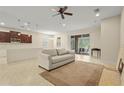 Spacious living room with neutral tones, tile floors, and access to the outdoor patio at 2920 Oriole Dr, Sarasota, FL 34243