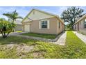 Charming single-story home with a brick paver driveway and well-maintained lawn and front window at 3362 Howell Pl, Sarasota, FL 34232