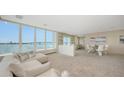 Comfortable condo living and dining room with ample seating and amazing water views at 350 Golden Gate Pt # 61, Sarasota, FL 34236