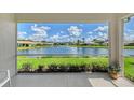 Expansive water views enhance this beautiful home, seen from the lanai at 4200 Reflections Pkwy, Sarasota, FL 34233