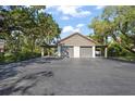 Spacious detached two-car garage, nestled among the trees with ample parking space at 4333 Trails Dr # 10-1, Sarasota, FL 34232