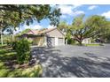 Detached two-car garage providing ample parking space, enhanced by lovely surrounding landscaping at 4333 Trails Dr # 10-1, Sarasota, FL 34232