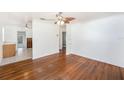 Bright living room with hardwood floors, ceiling fan, and neutral walls at 5028 Oxford N Ave, St Petersburg, FL 33710