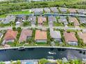Aerial view of homes on deep water canals with boat docks at 584 Mast Dr, Bradenton, FL 34208