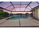Relaxing screened-in pool and spa overlooking a tranquil lake at 11328 Rivers Bluff Cir, Lakewood Ranch, FL 34202
