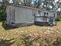 Image of home showing exterior elements and yard space at 13023 Taylor St, Brooksville, FL 34613