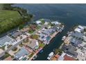 Waterfront home with boat dock, pool, and lush landscaping in a desirable coastal community at 3715 Bamboo Ter, Bradenton, FL 34210