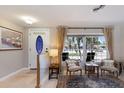 Cozy living room with natural light, tile floors, area rug, and stylish furnishings at 3715 Bamboo Ter, Bradenton, FL 34210