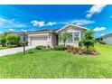 Charming single-story home with lush landscaping and well-manicured lawn at 4324 Dairy Ct, Lakewood Ranch, FL 34211