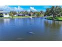 Picturesque waterfront view, perfect for boating and observing local wildlife like the serene manatees in the canal at 5572 Shadow Lawn Dr, Sarasota, FL 34242